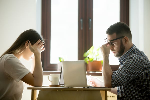 2 Frustrated Difficult coworkers at desk