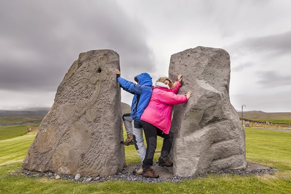 2 Female-Travelers-Having-Fun between rocks