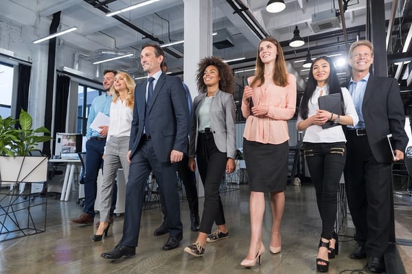 Leaders walking confidently with his team