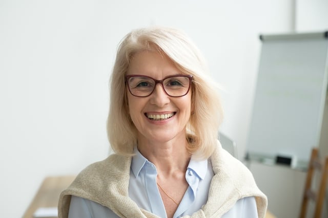 Smiling Professional Older women with glasses