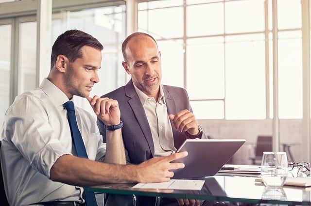 BS-Businessmen Using tablet at table.jpg