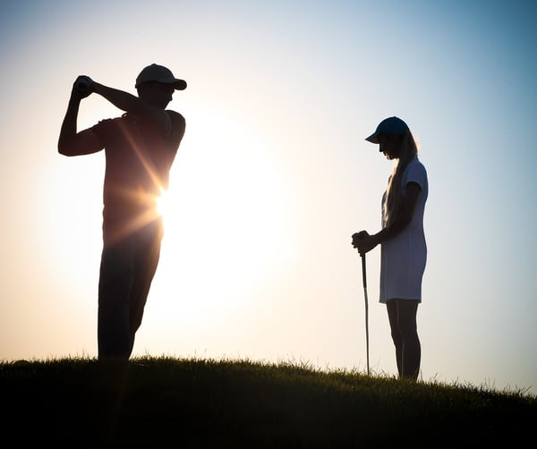 Male-And-Female Golfers