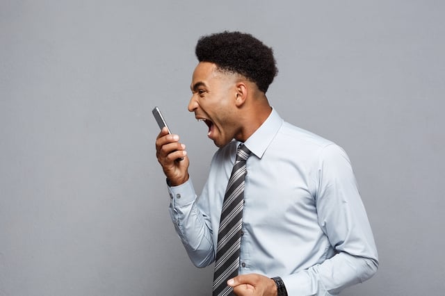 Stress  signs Young Black man screaming into cellphone