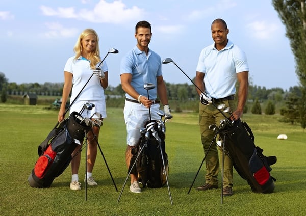 three-golfers with their golf bags