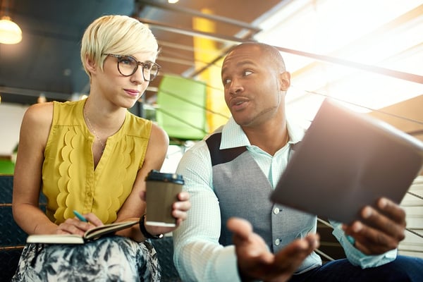 BS-2-young-diverse-people-coffee-and-looking-at-notepad