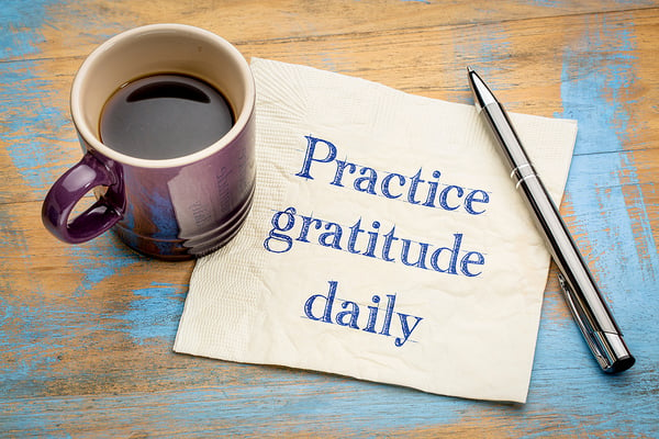 Practice-gratitude-daily-reminder cup and napkin