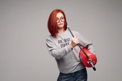 Red Headed Woman with Extinguisher for fire drill