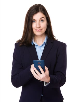 Brunette businesswoman using smart phone