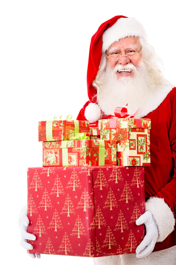 Happy Santa with Christmas gifts - isolated over a white background