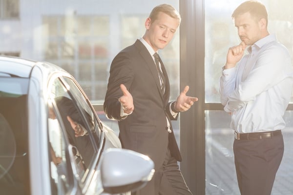 Image of car dealer offering expensive vehicle