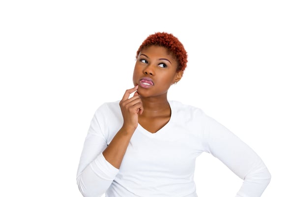 Portrait young woman thinking daydreaming something, plotting revenge looking away, isolated white background. Human emotions, facial expressions feeling, reaction, life perception, body language