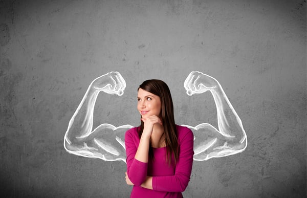 Woman with chalk muscles background showing her strenght