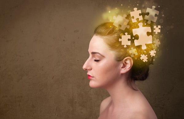 Young person thinking with glowing puzzle mind on grungy background-1