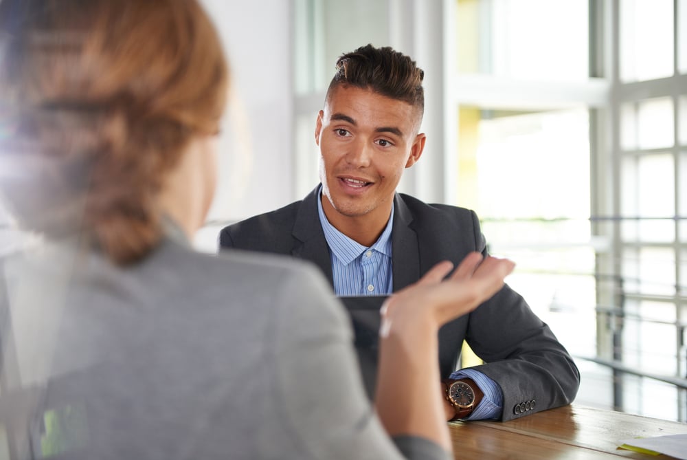 Female and male worker in a feedback session