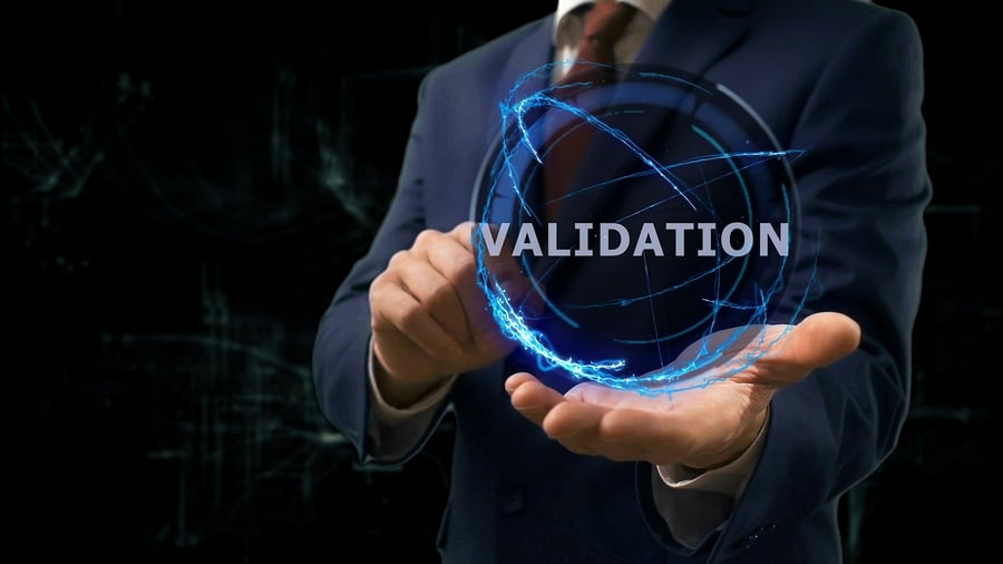 Man's hands holding Validation hologram